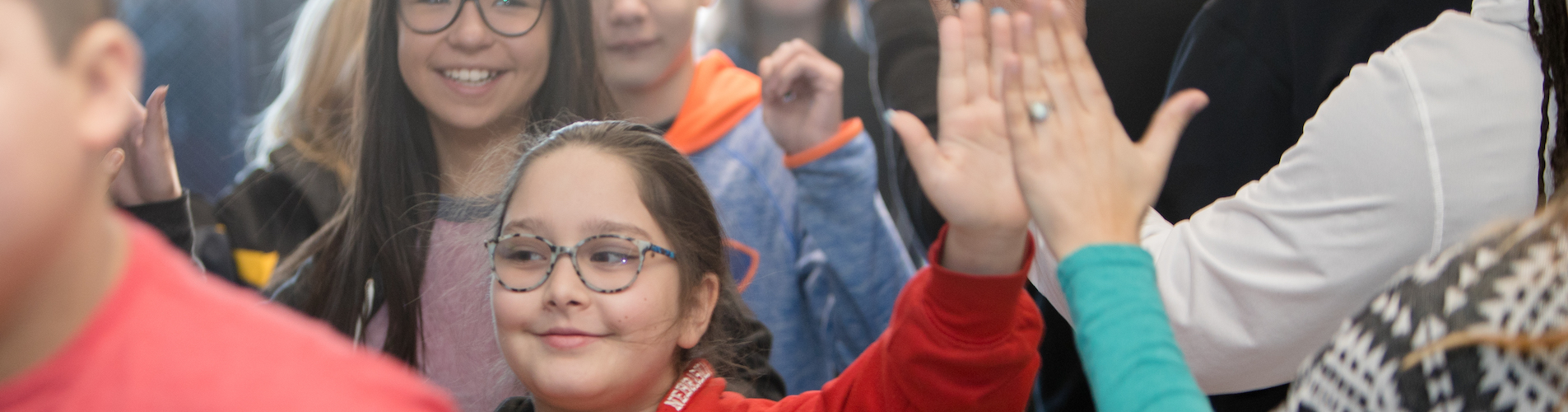 students giving high fives